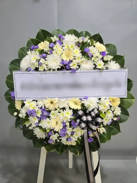 พวงหรีดเยอบีร่า โทนเหลืองขาวม่วง